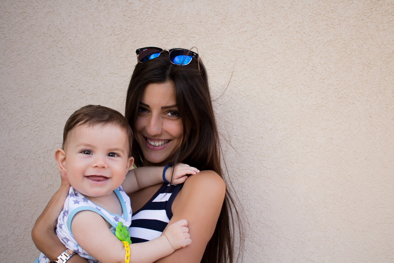 An aunt holding her baby nephew.