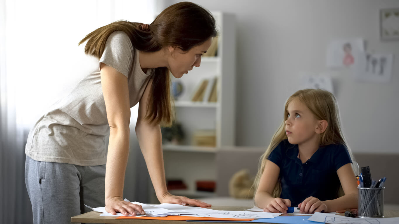 A mother talking to her daughter about losing objects at school.