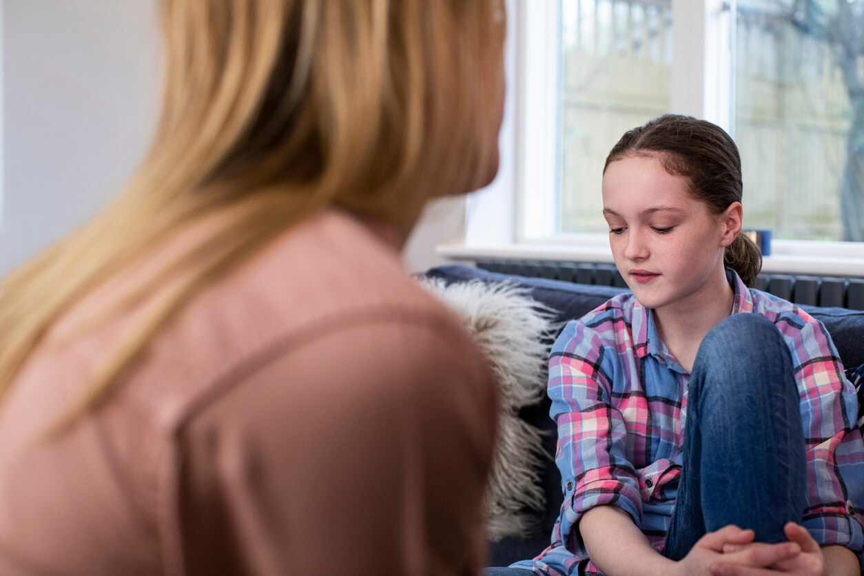 A pre-teen talking to her mom.