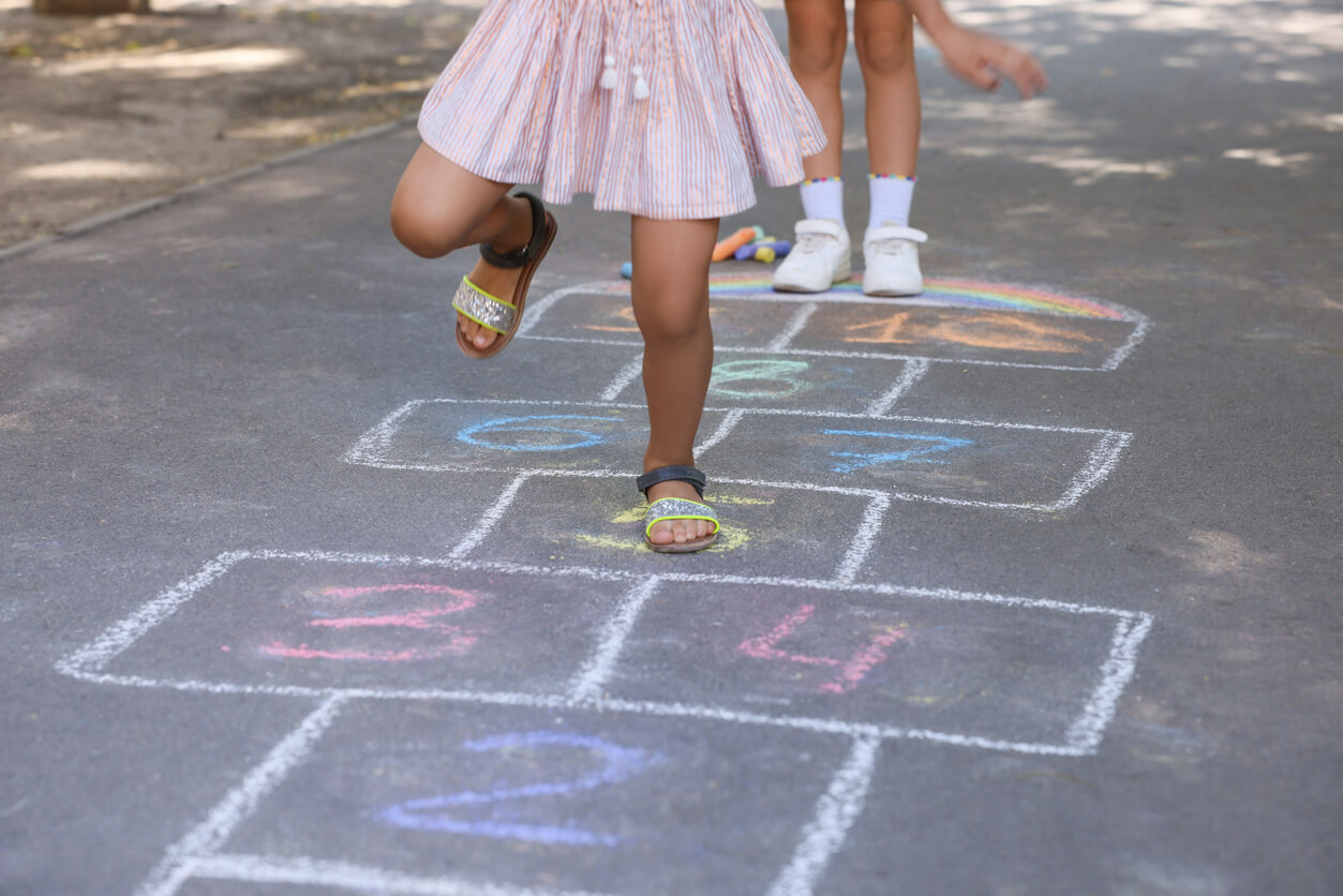 Children playing hopscotch.