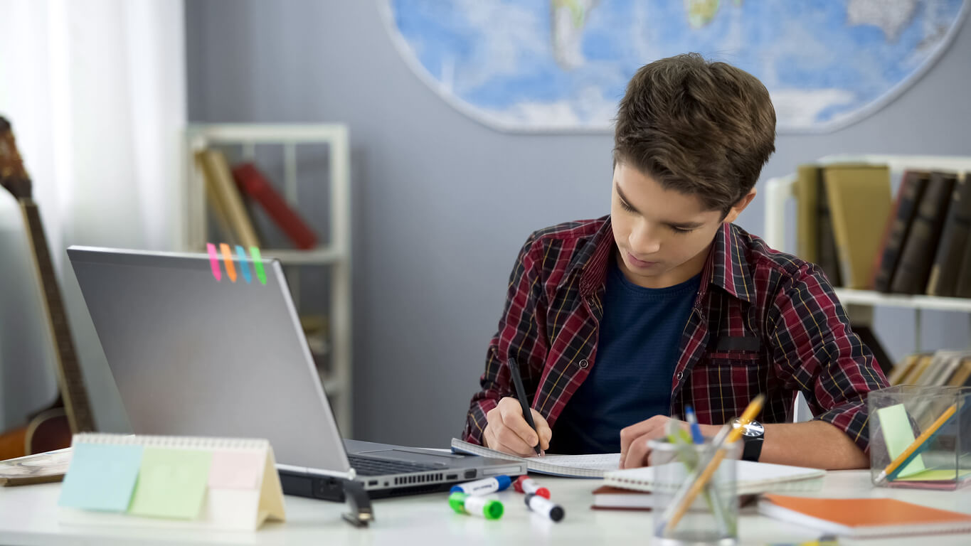 A student being responsible with his school work.