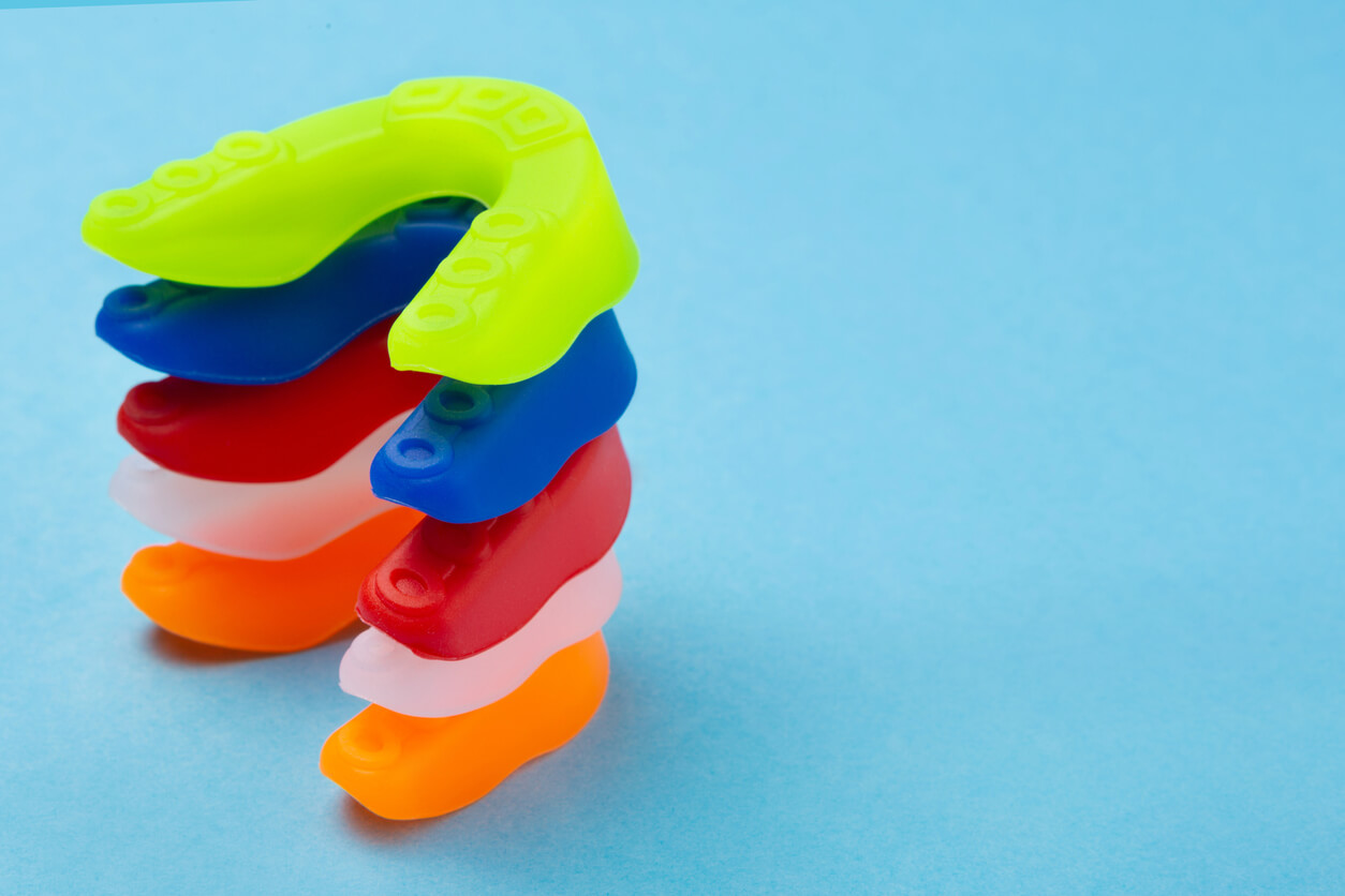 A pile of colorful mouthguards.