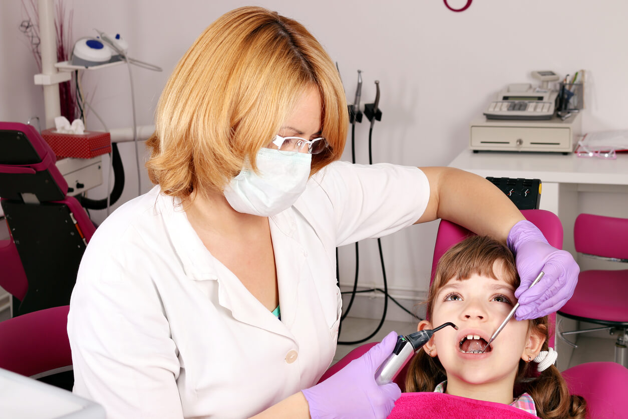 A young girl during a dentist visit.