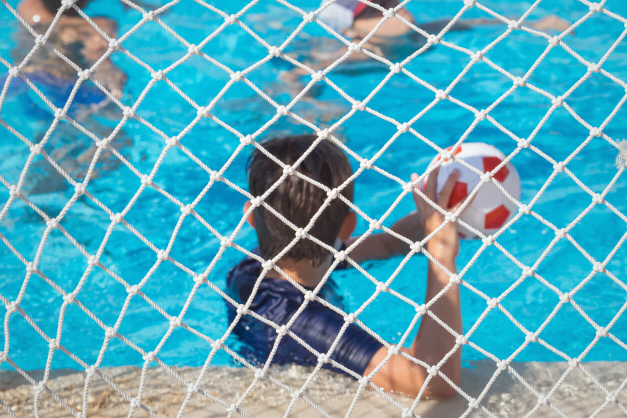 Children playing water polo.