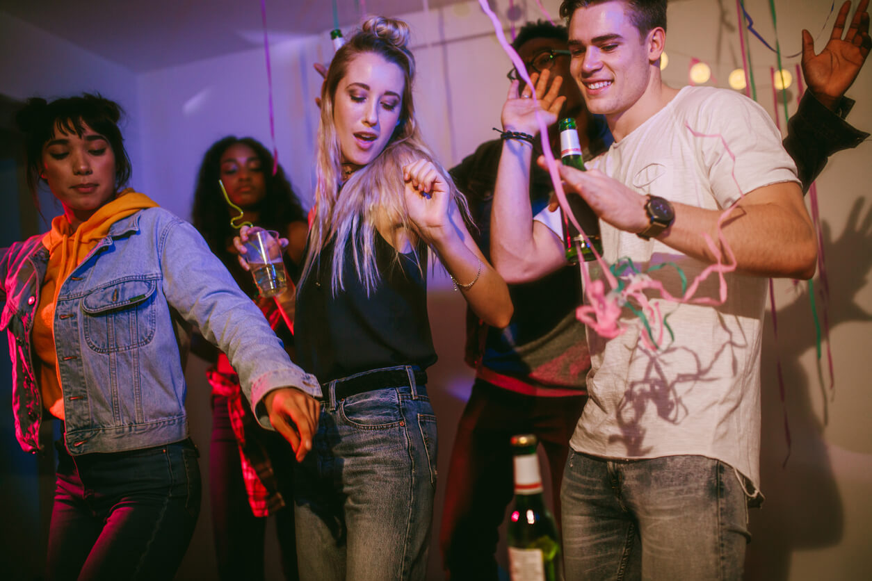 Teens dancing at a party.
