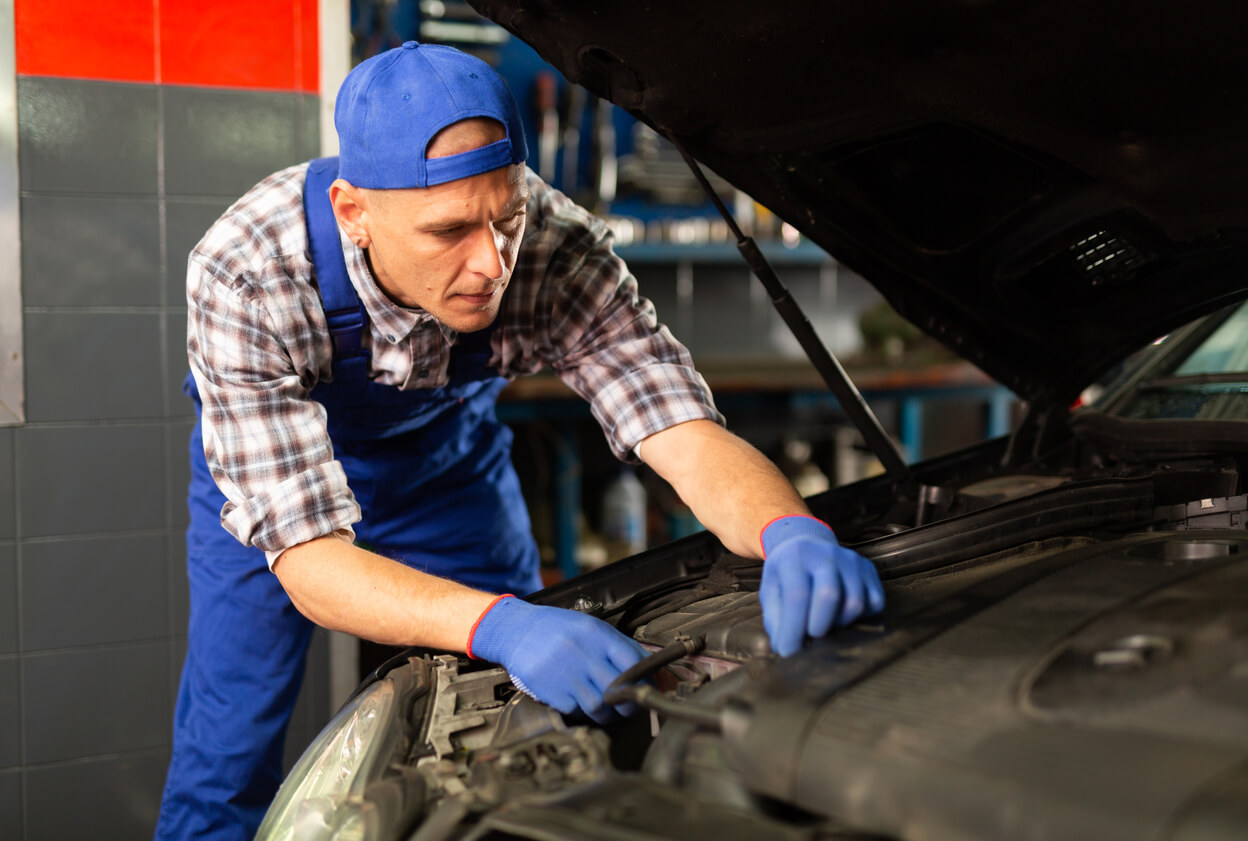 A mechanic fixing a car.