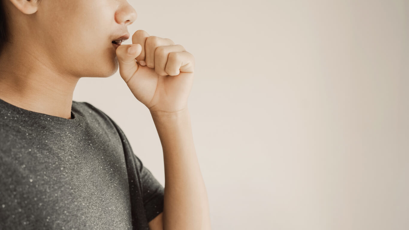 A boy coughing.