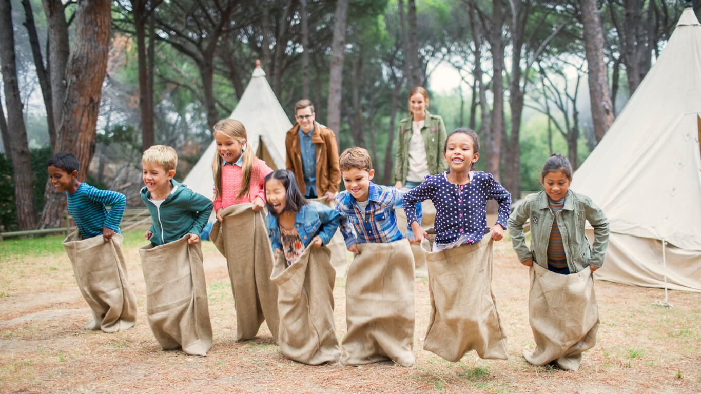 Children playing a sack race.