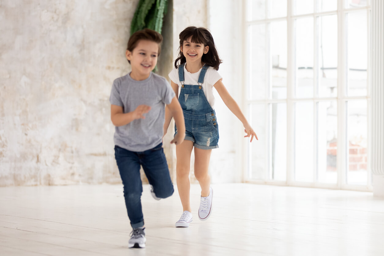 Children running indoors.