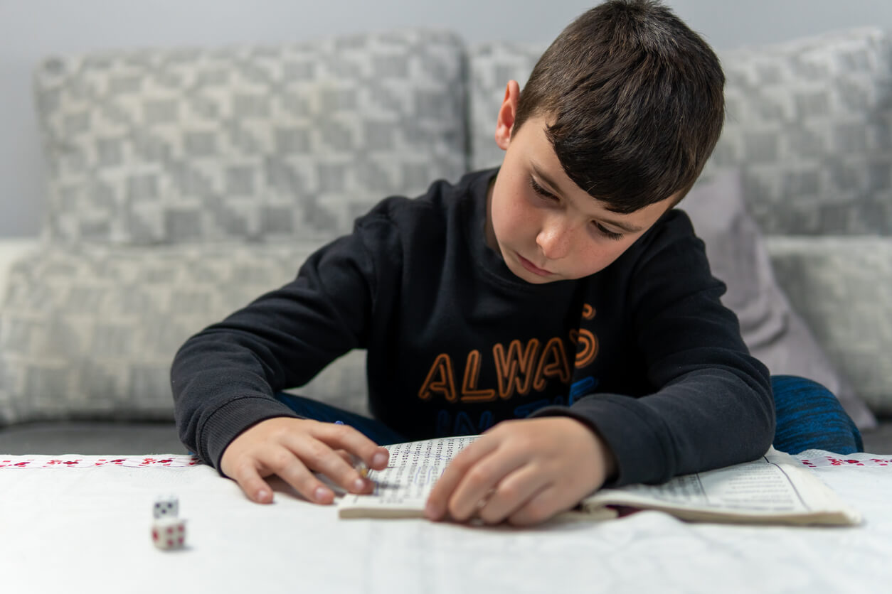 A young boy doing a word search.