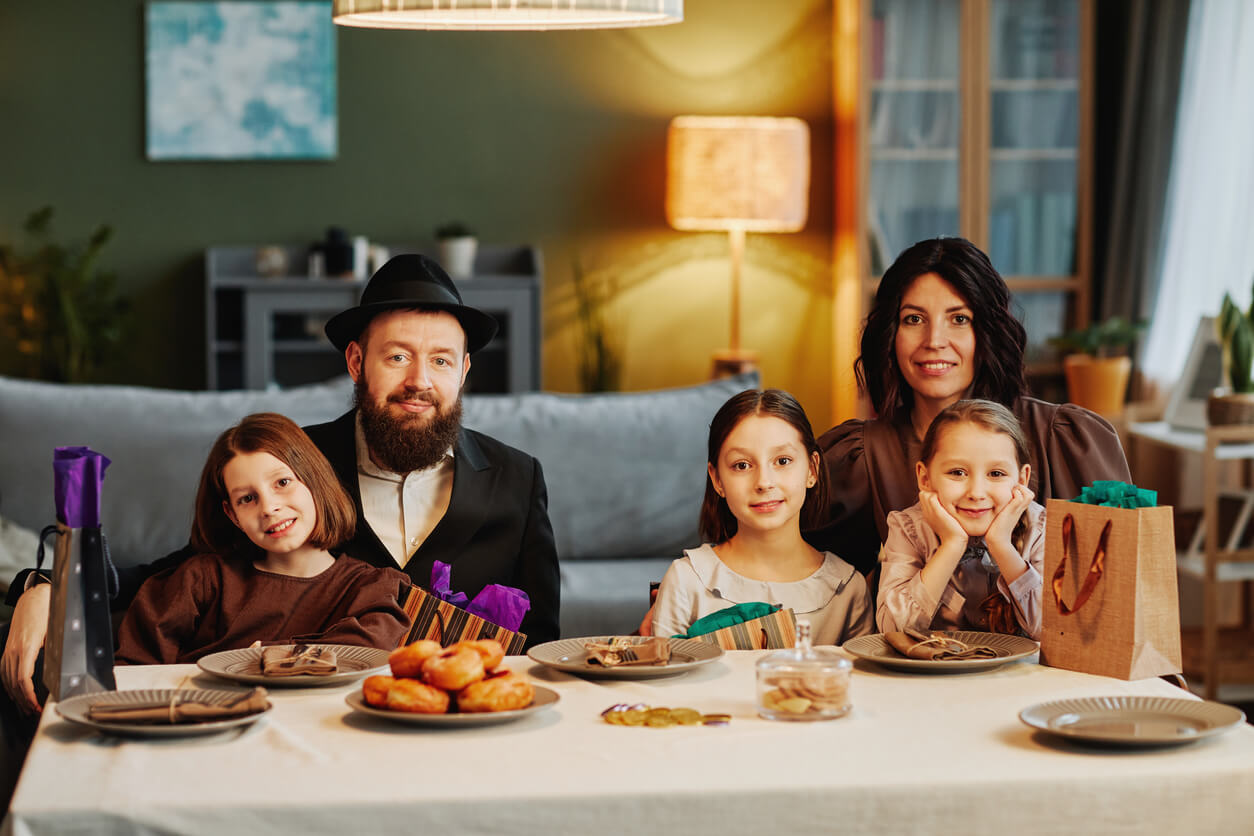 A Jewish family sitting down for a meal.